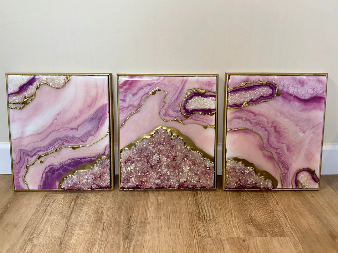 Pink and gold resin geode triptych with crushed crystal texture and gold framing.